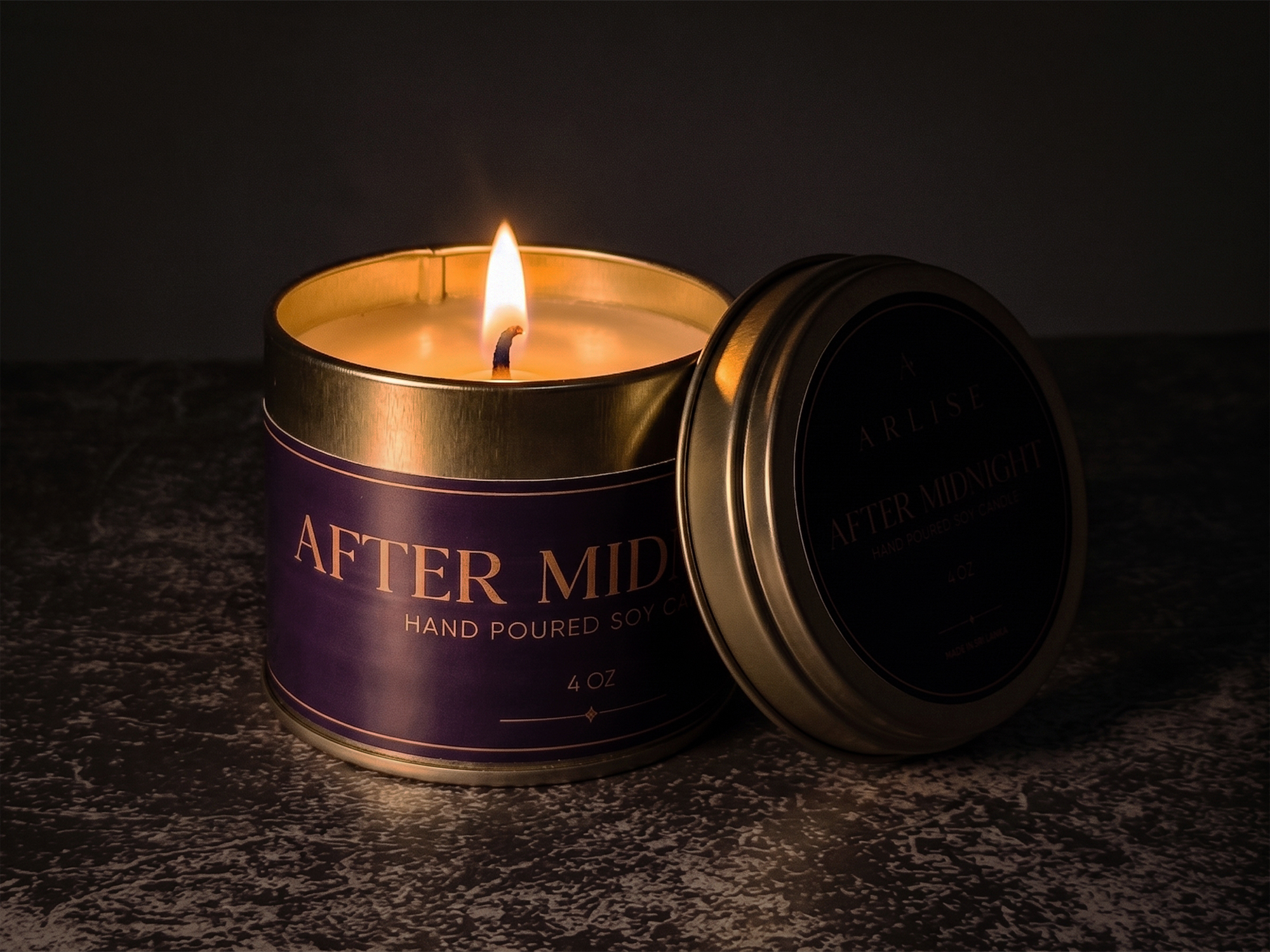 AFTER MIDNIGHT jasmine and green tea soy candle burning in a darkened room