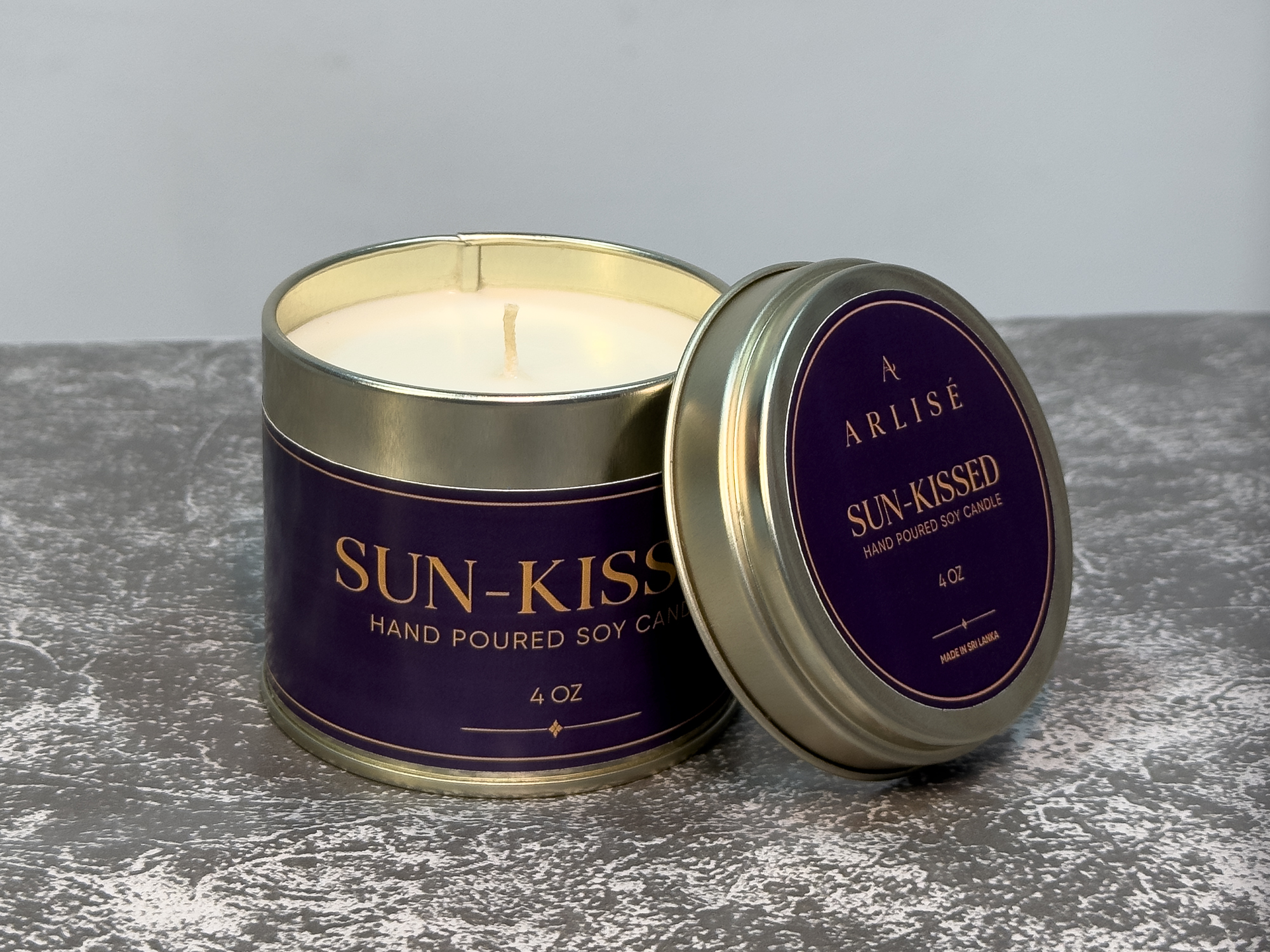 SUN-KISSED lemongrass soy candle in its tin, unlit, in warm daylight